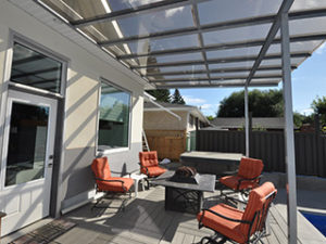 Stylish patio with glass patio cover in Saskatchewan