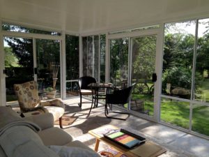 Interior view of a two season sunroom with tile floor
