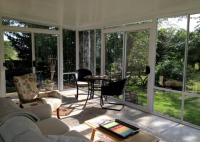 Interior view of a two season sunroom with tile floor