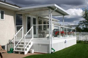 Aluminum glass and picket railings with small patio cover