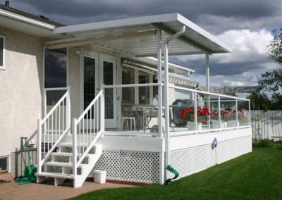 Aluminum glass and picket railings with small patio cover