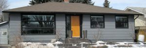 Light stained insulated wood door to home in Saskatoon