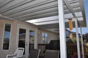 White aluminum pan roofed patio cover and aluminum posts
