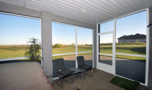 Screen room interior with hot tub looking out over Saskatchewan prairie